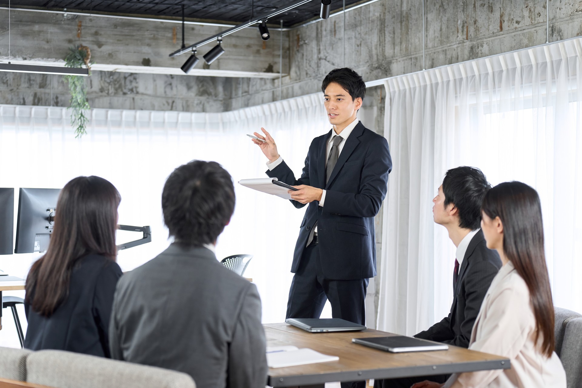 Businessman training new employees in the office